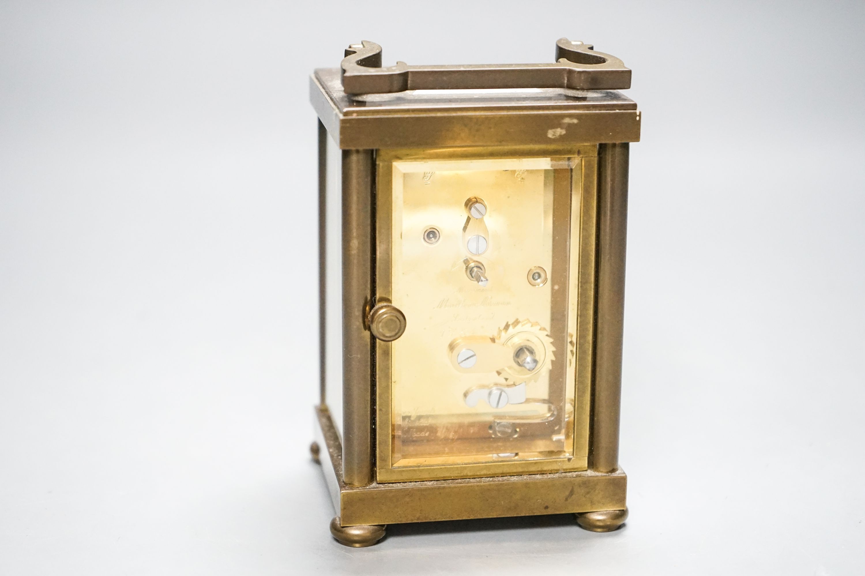 A Matthew Norman brass carriage timepiece, 15 cm high with the handle up